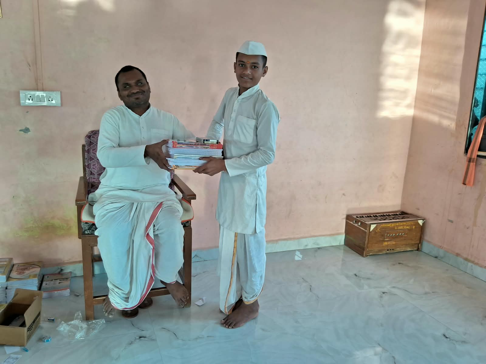 Student receiving notebooks