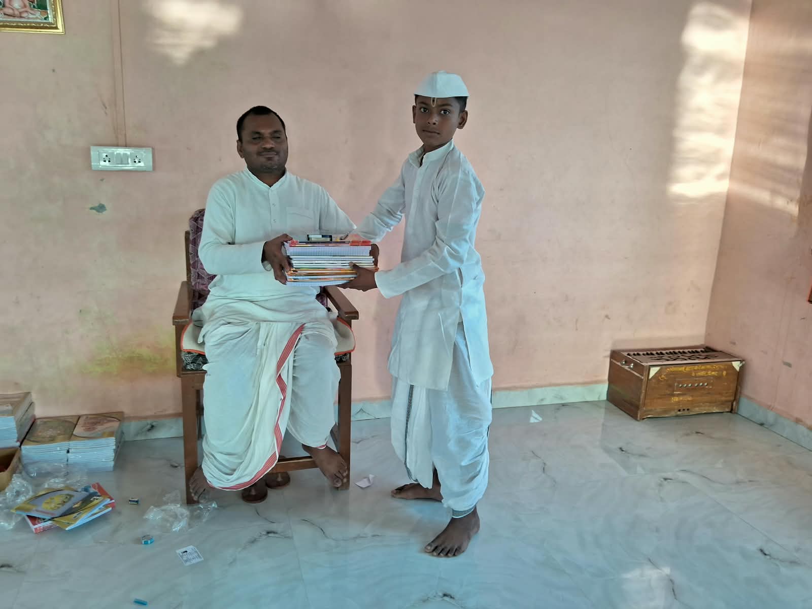 Student receiving books